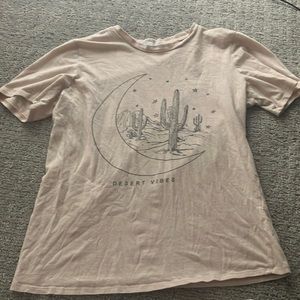 This is a cream t-shirt in a size kids small.